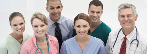 A group of veterinarians smiling at the camera