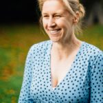 Dr Zoe Belshaw outdoors, smiling
