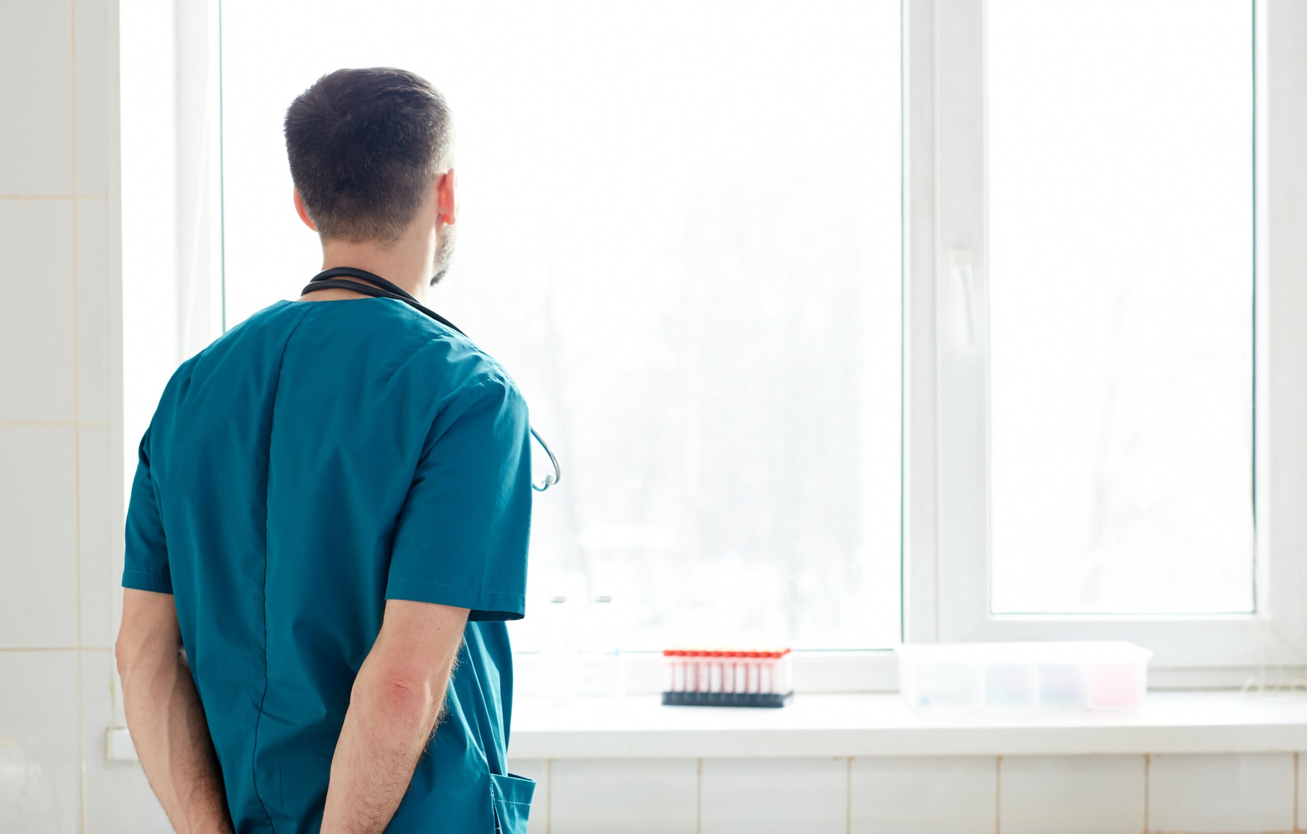 Vet looking out of a window